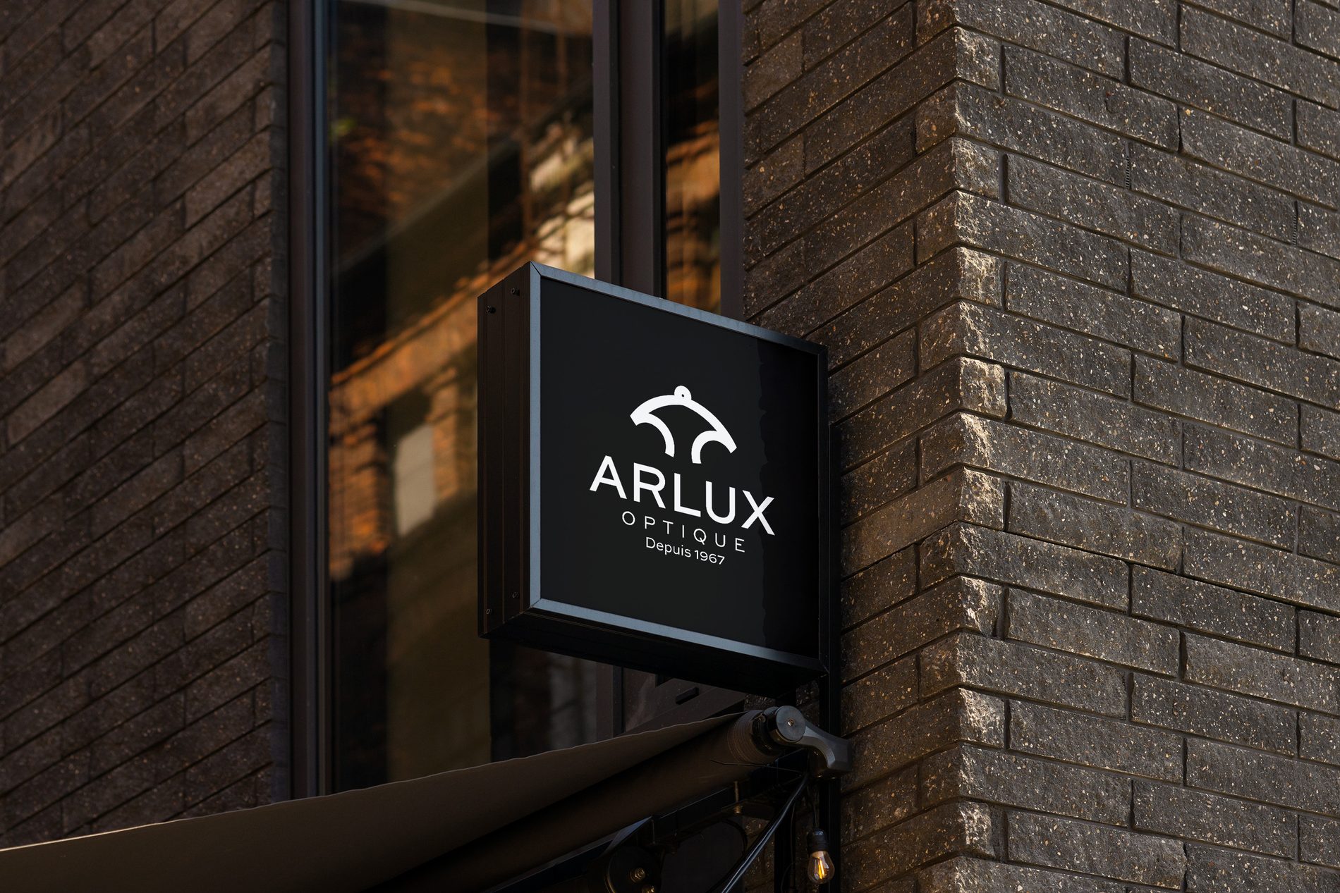 The Arlux sign above the storefront