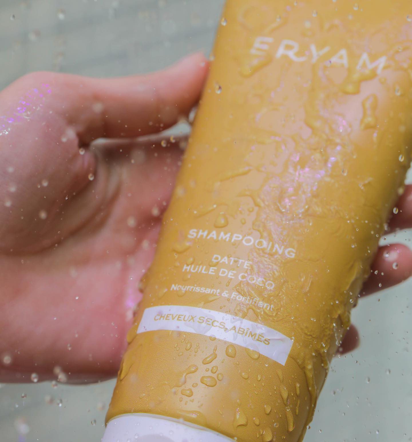 An Eryam shampoo in use